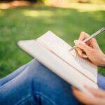 Woman writing in notebook